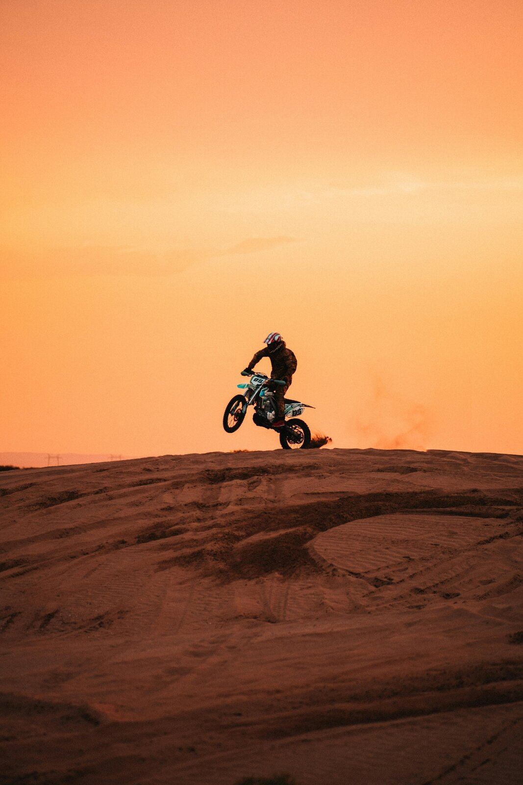 Rider catching air on a desert dune